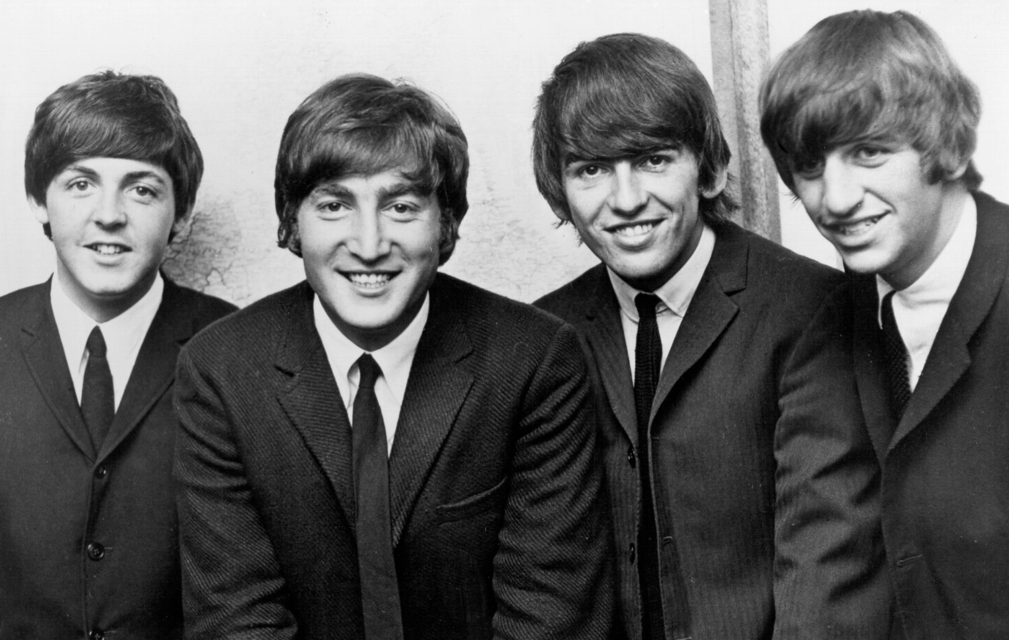 Les Beatles posent pour un portrait vers 1962.