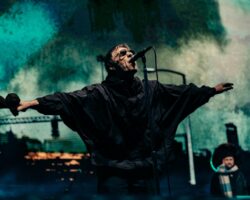 Liam Gallagher performing live on stage with Oasis, photo by Big Brother Recordings